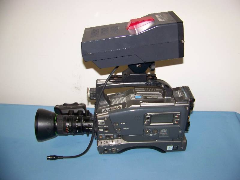 lot 52 image: (2) JVC, DV Camcorders, (2) Hand Held Camera Control Remotes and View Finders