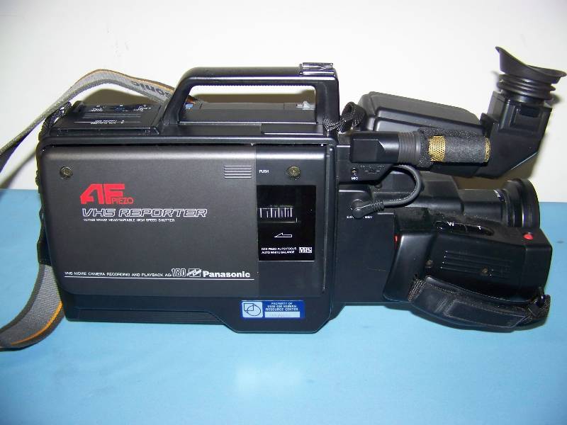 lot 57 image: Panasonic, VHS Reporter, VHS Movie Camera for Recording and Playback with AC Adapter in Hard-Sided Case