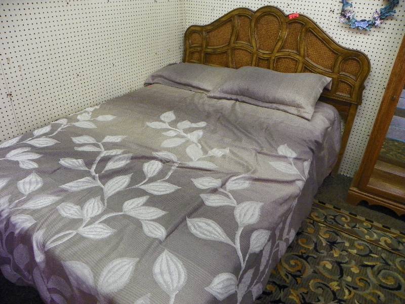 Nicely designed headboard, bed frame, mattress, box spring, bedding