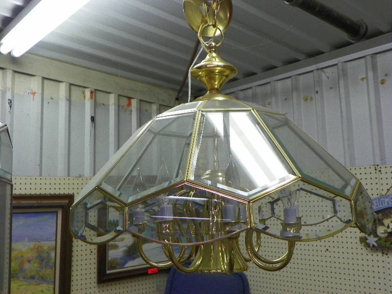 Hanging electric lamp, metal and glass, candle style light holders, gold colored with glass panels