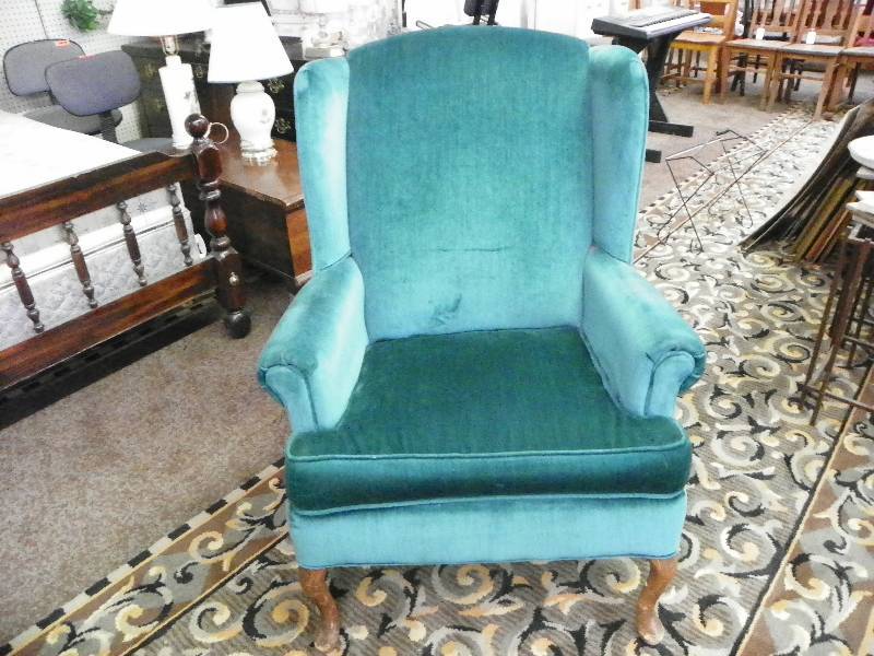 Teal velour wing back chair