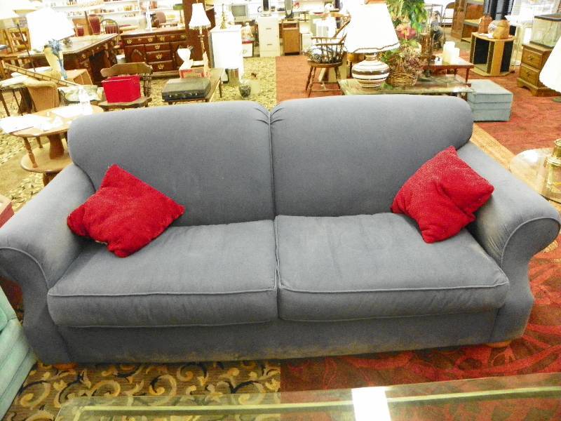 Blue Home Wear couch with pillows, stains
