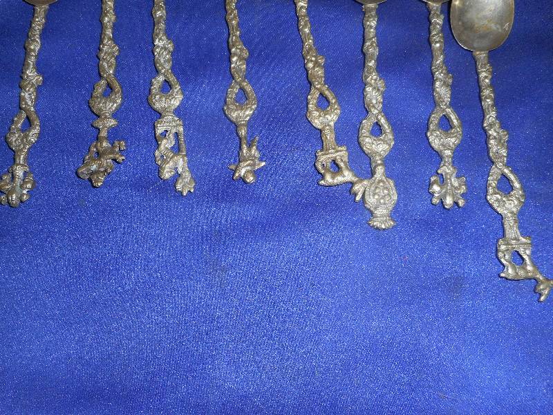8 DECRATIVE SILVER COLLECTOR SPOONS