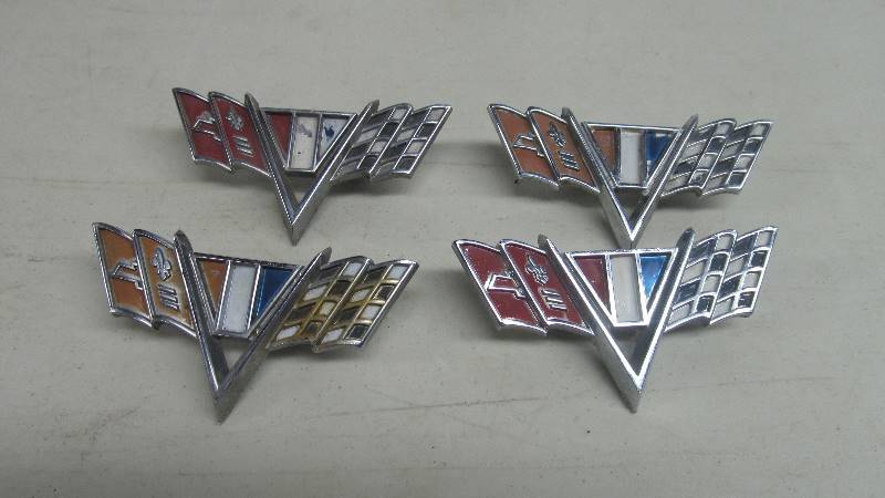 lot 37 image: Set of 4 Original 1960s Chevrolet Checkered Flag Emblems