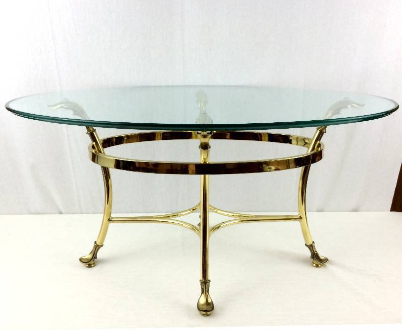 lot 3 image: Stunning High Style Vintage Labarge Era Italian Hollywood Regency Brass Acanthus Leaf With Hoof Feet 33 Diameter Oval 12 Thick Glass Cocktail Table is in Spectacular Vintage Condition Check Out The Other One In Lot 4