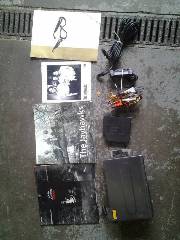lot 18 image: 6-Disc CD Changer, John Lennon Album, Jayhawks Autographed Poster, Ray Charles Book