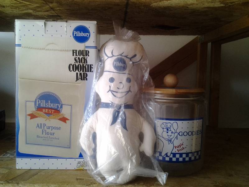 lot 53 image: Pillsbury Flour Sack & Glass Cookie Jars, Stuffed Dough Boy