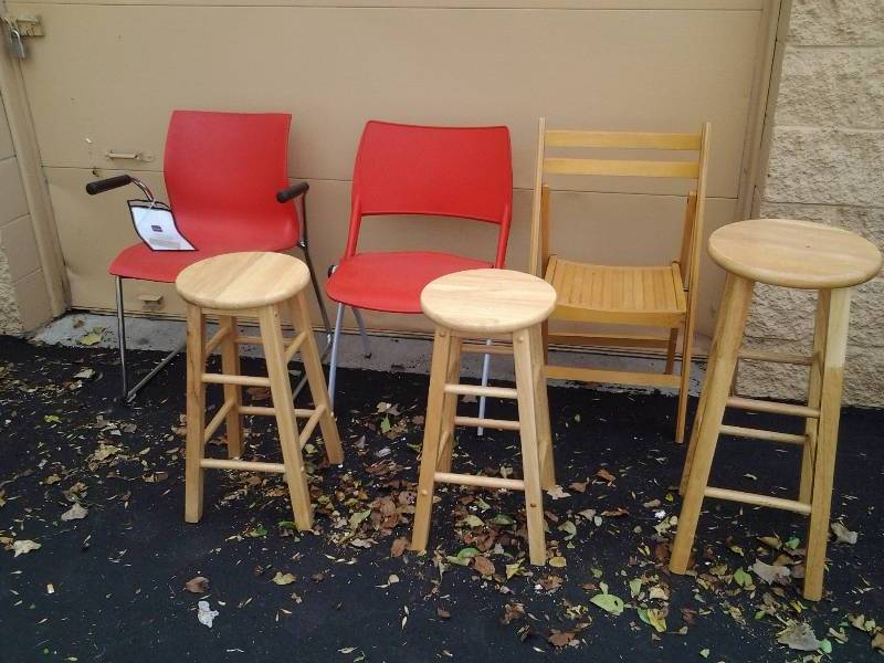 lot 104 image: 1-Teknion Red Chair, Other Red Chair, 3-Wood Stools, 1-Wood Folding Chair