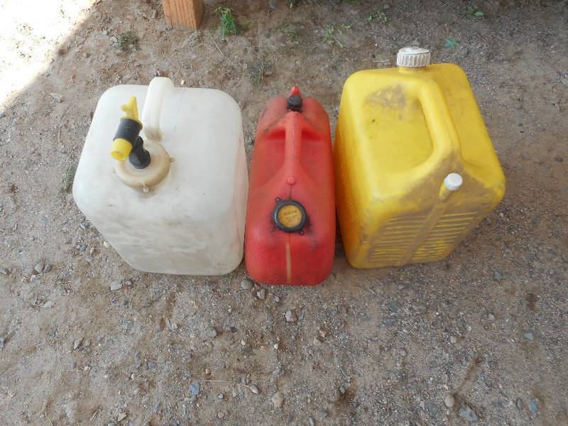 2 PLASTIC FUEL CANS 1 WATER JUG