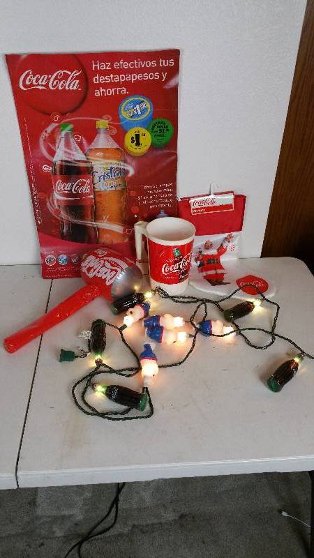 lot 79 image: Coca-Cola Bottle  Polar Bear String of Lights, Mug, Advertising, Etc.