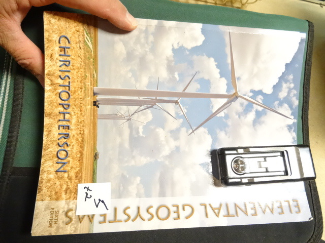 lot 5 image: College Book (Elemental Geo Systems 6th edition) & book light