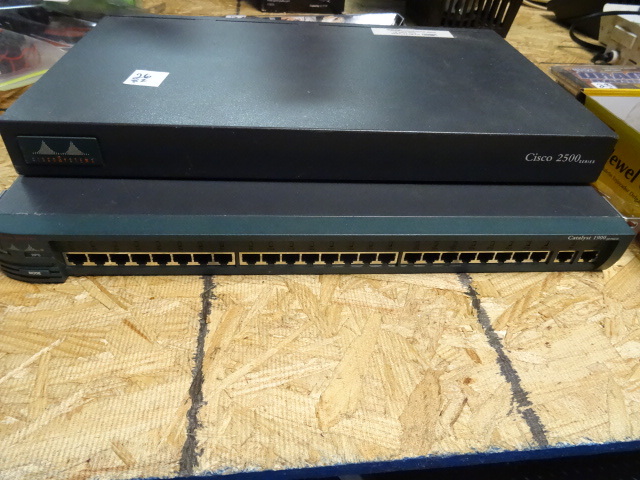 lot 26 image: Cisco 24 port Switch 1900 and Cisco 2500