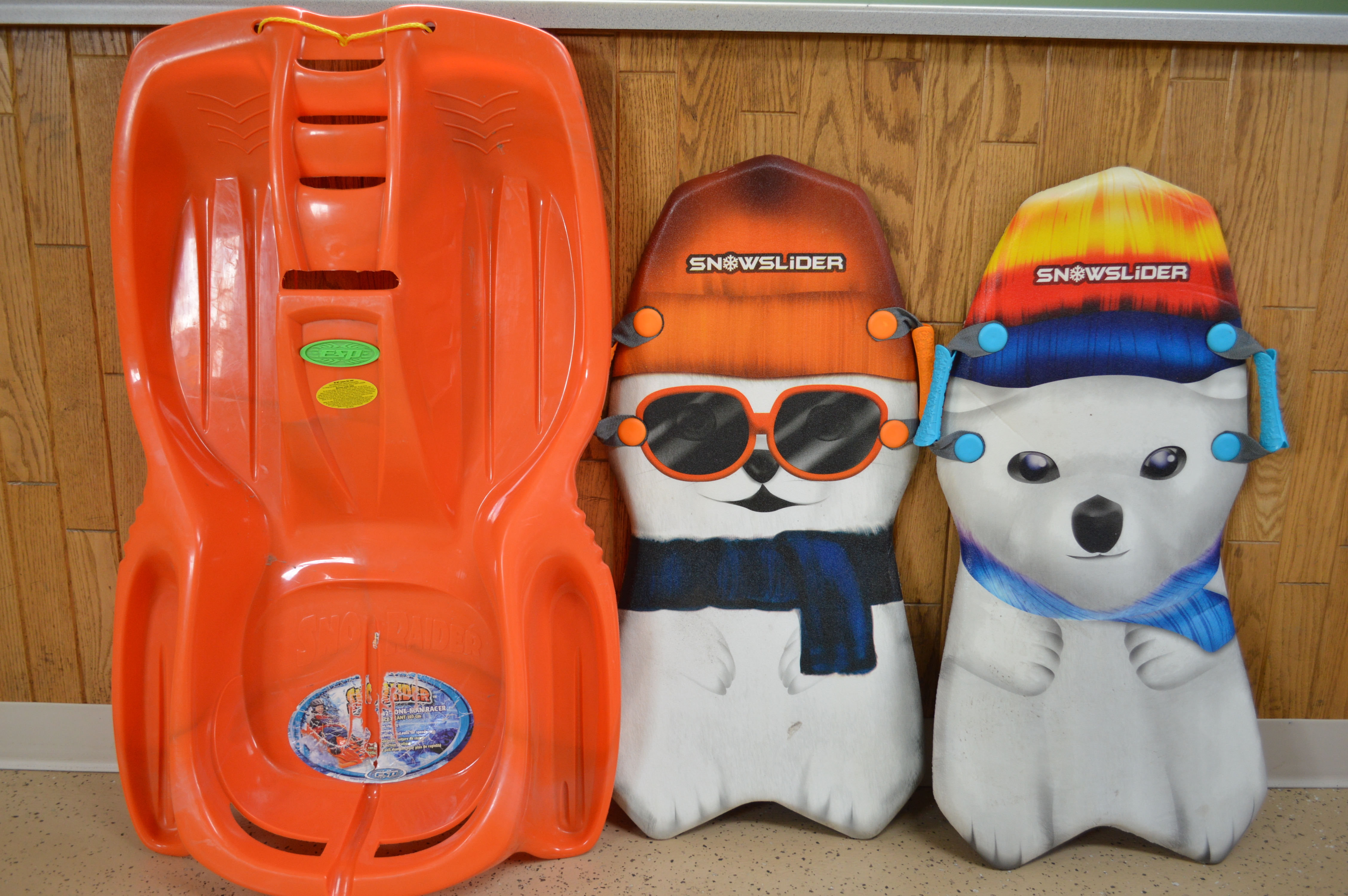 lot 24 image: Childrens snow sleds three total