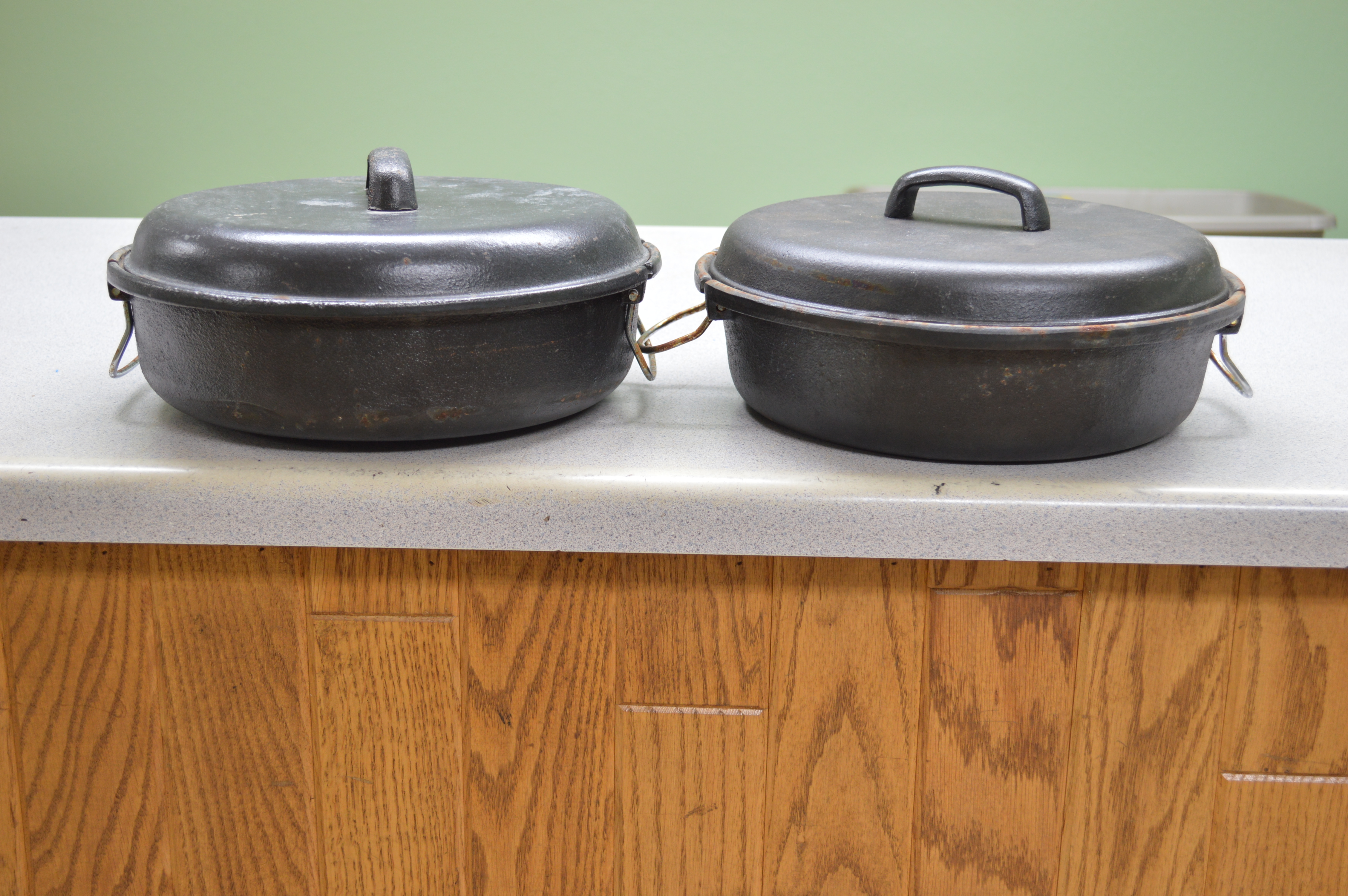 lot 37 image: 2-10 Cast Iron dutch ovens