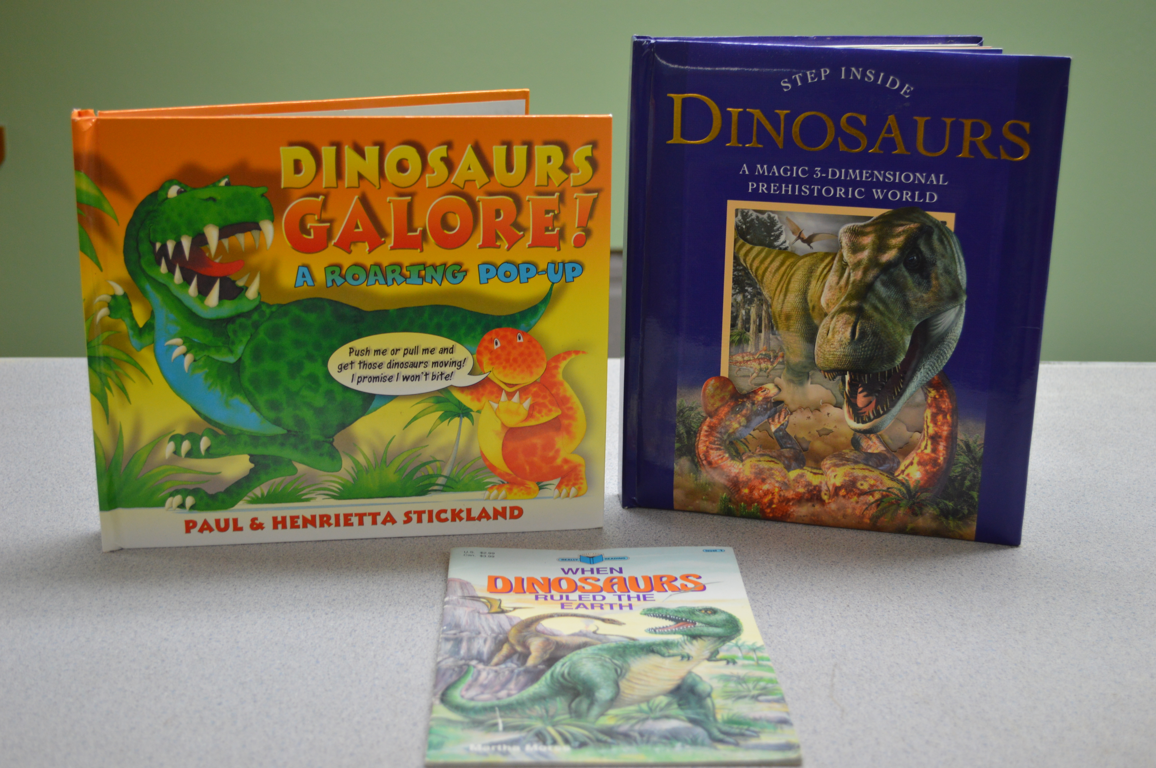 lot 49 image: 3-Pop up dinosaur books