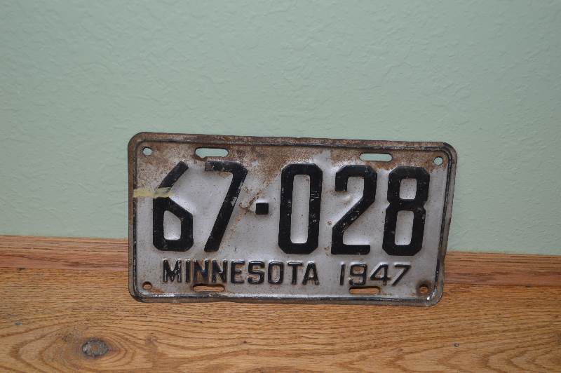 lot 64 image: 1947 MN License plate some rust