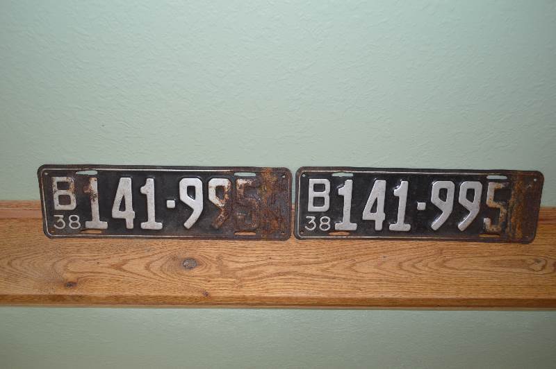 lot 66 image: 2-1938 MN License plates with rust