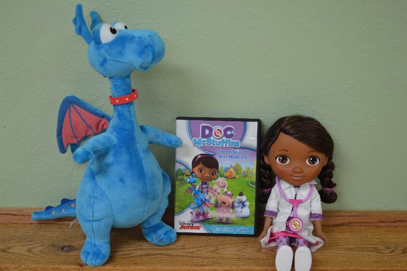 lot 74 image: Disney Doc McStuffins DVD and matching dolls.