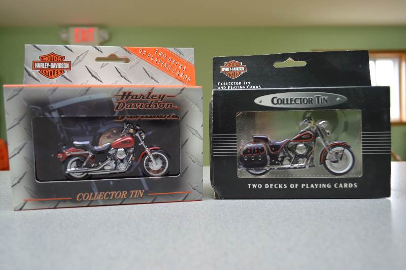 lot 79 image: Harley Davidson collector playing card tins.