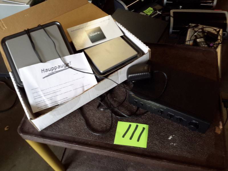 lot 111 image: OPTIMUS SA 155 Integrated Stereo Amplifier  HAUPPAUGE, Beyond TV  HD PVR.. Not sure what this is, but there are two of them.