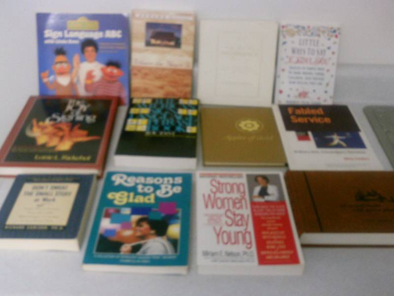 lot 60 image: Books (12) Sign language, inspirational self help