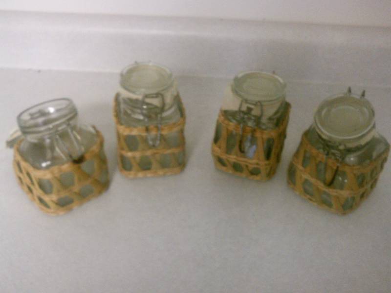 lot 79 image: Canisters, locking buckle clasp with wicker accents (4)