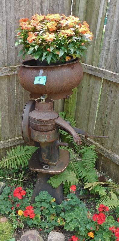rusty cream separator garden art