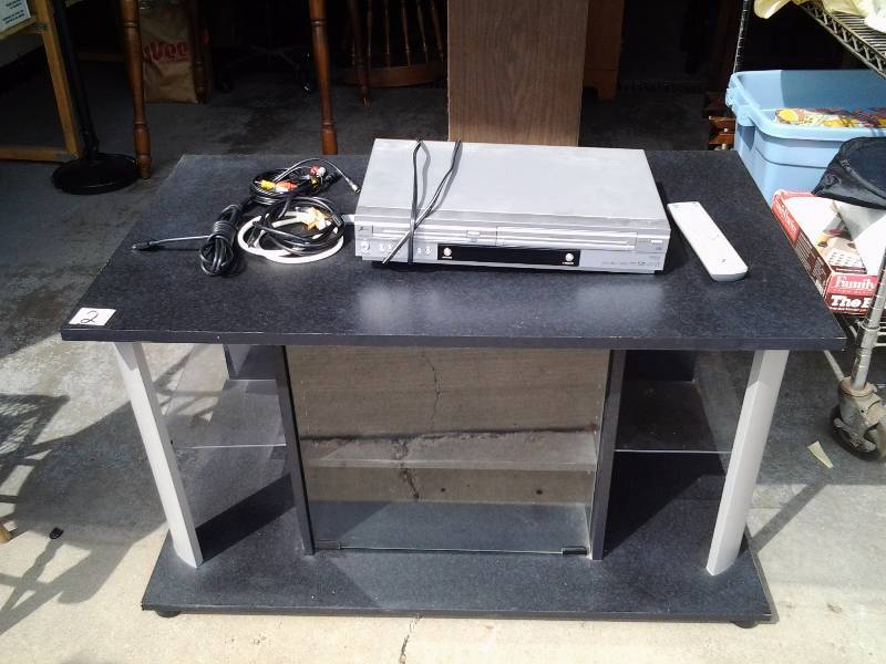 lot 2 image: Black TVMedia Stand With Glass Door & Glass Shelves 40x23x32