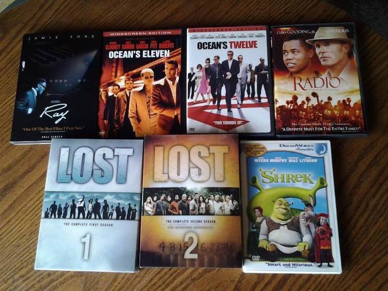 lot 3 image: Assorted DVDs-Oceans 11&12, Lost Seasons 1&2, Shrek, Ray, Radio