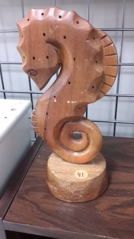 Genuine monkey pod carving of a seahorse