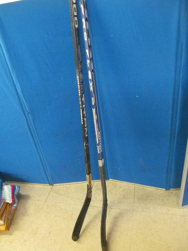 lot 53 image: Titan hockey sticks