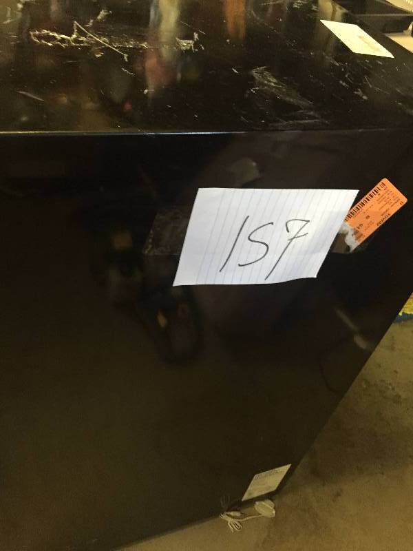 lot 157 image: Frigidaire 4.5 Cu. Ft. Compact Refrigerator. 21-14 W x 23 D x 33-78 H. FFPE4522QM has scratches and small dents but it is in like new