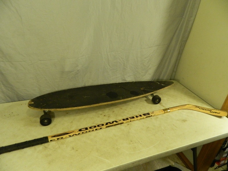 lot 215 image: Longboard Skateboard and Hockey Stick