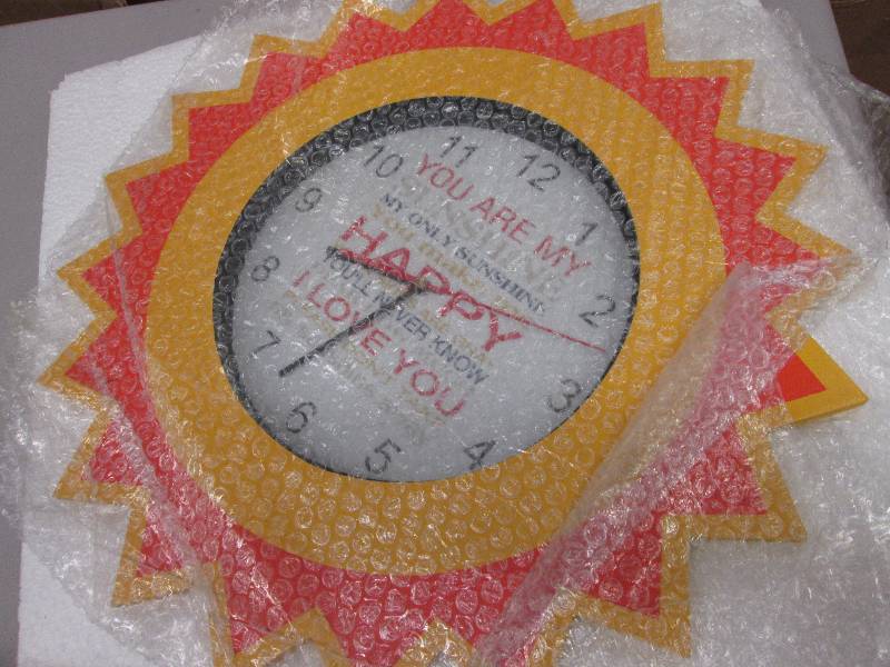 lot 35 image: You Are My Sunshine Clock open box,...