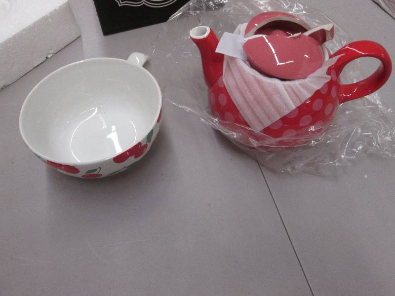 lot 95 image: Teapot & Cup Set , top of teapot br...