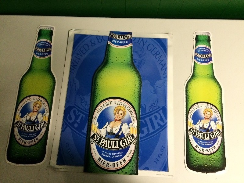 lot 19 image: THREE ST PAULI GIRL BEER TIN SIGNS