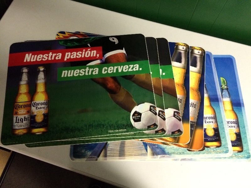 lot 21 image: SEVEN LARGE CORONA SIGNS TABLE MATS