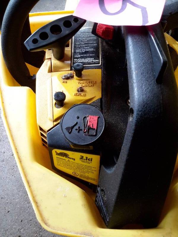 lot 15 image: 2.1 Cu in  McCullough, 14 in Bar, Chain Saw.. Tested and works well. Case included