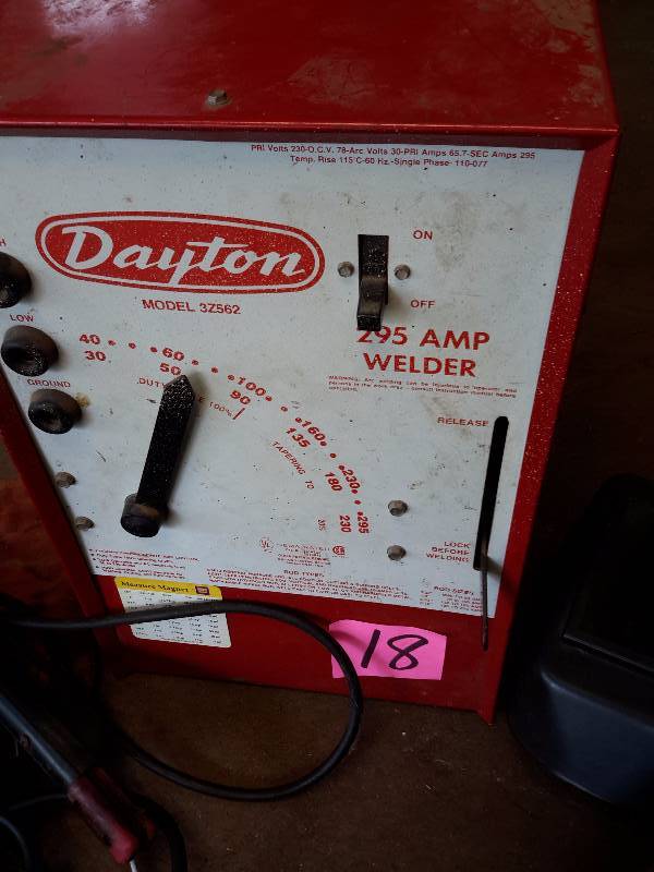 lot 18 image: DAYTON 295 AMP Welder.. 2 helmets, Cords and Gloves included.. Works well.. 220V