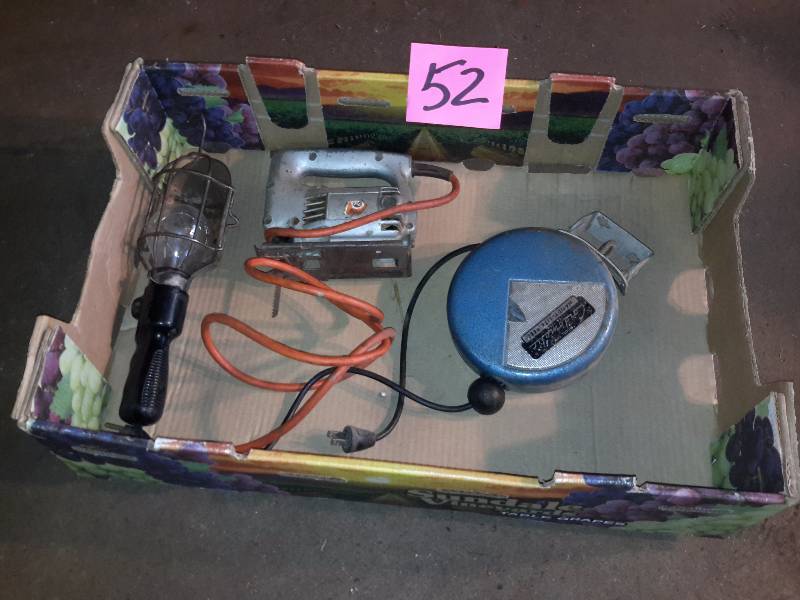 lot 52 image: Retractable Trouble light  Black and Decker Jig Saw.