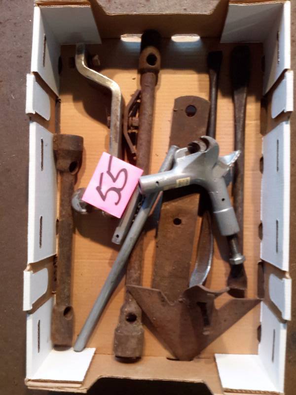 lot 55 image: Bead Breaker, Tire Wrenches, Cultivator Shoe, Older Vehicle specific wrenches, hitch and ball.