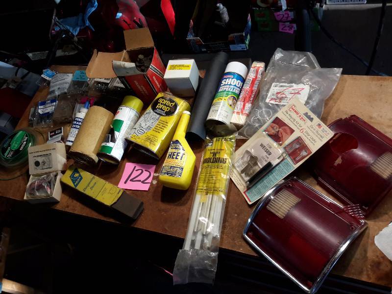 lot 122 image: Misc. Liquids and hardware items.  2, Vintage Tail light glass (1 broken).  Ohm Tester, Sharpening Stone and more