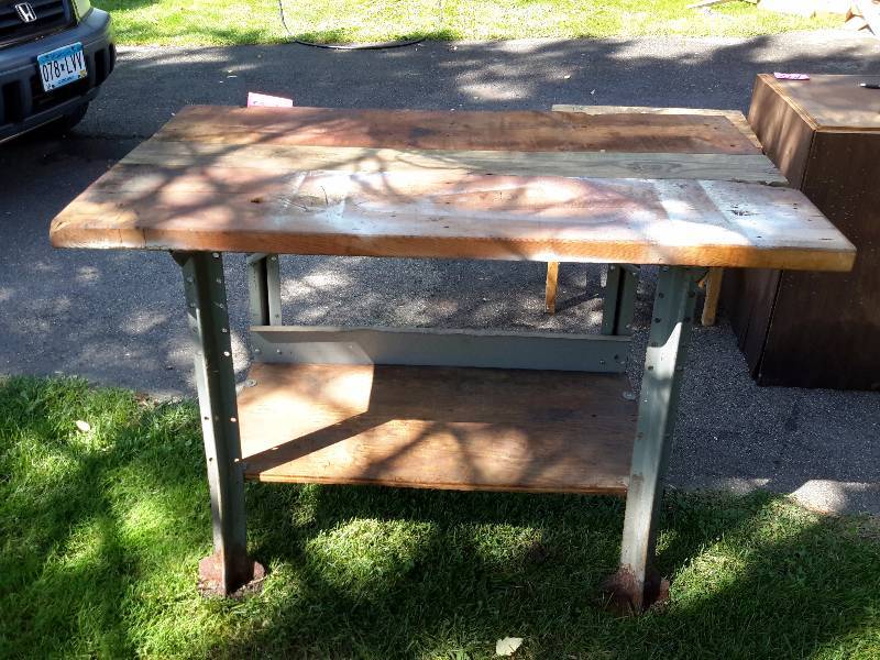 lot 147 image: Metal with wood top work bench.. Bottom shelf.  48in x 28 in x 34in h