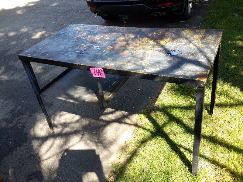 lot 148 image: Solid steel work bench with shelf.. VERY HEAVY.. Bring your own loading help.  54 in x 28 in x 31 12in h