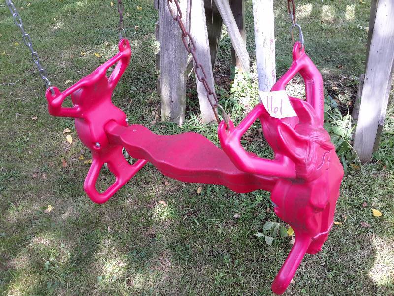 lot 161 image: Heavy Red Plastic Playground Horse with chains.. You must take this down yourself.