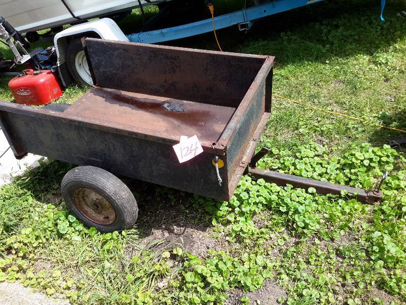 lot 124 image: Utility Trailer for pulling behind lawn tractor.. Has DUMPING capability as shown.  44in x 29 in x 26in h (box is 12in deep).