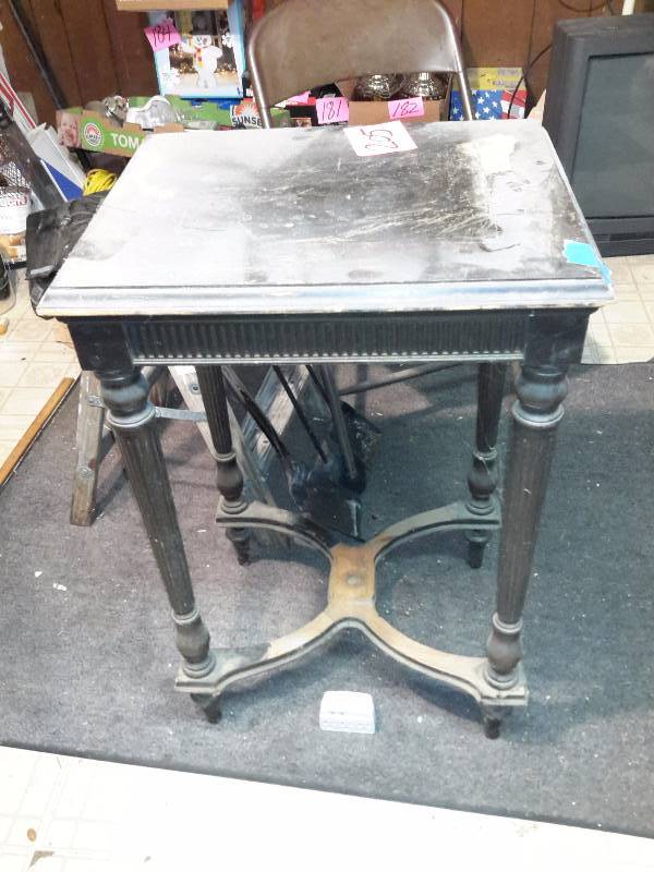 lot 205 image: Very old Table with some of the veneer missing.. Old Wood seat Folding chair, Small Step stool (top cracked) Fire place tools