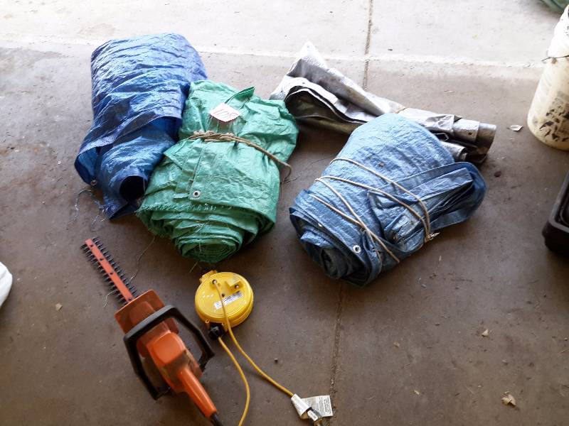 lot 108 image: Lot of Plastic Tarps,  Retractable trouble Light.  Electric Hedge Trimmer