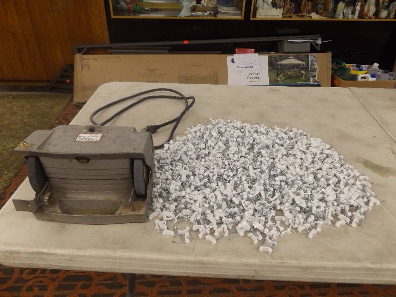 lot 21 image: Bench Grinder and bucket of wire fasteners