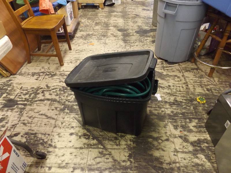 lot 621 image: Tote with garden hose and extension cords